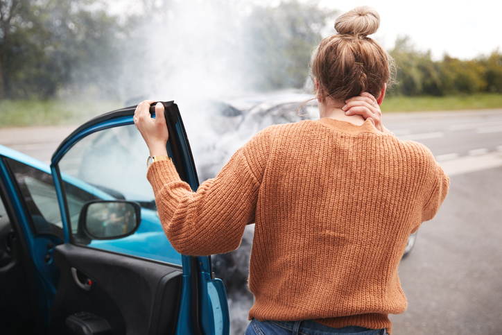 Woman Holding Neck After Accident